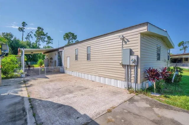 a swimming pool with outdoor seating and yard