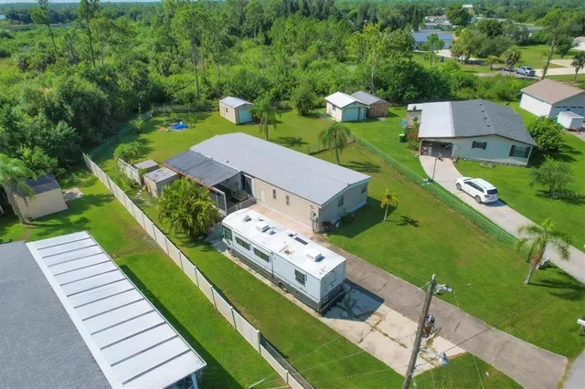 a picture of a room with a white wall and a painting