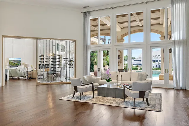 a kitchen with stainless steel appliances a white cabinets and chairs