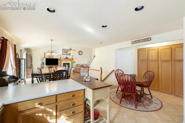 a living room with furniture a flat screen tv and a large window