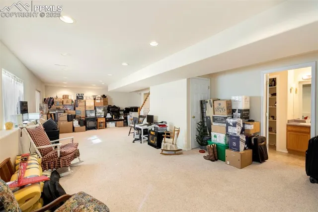 a living room with furniture and gym equipment