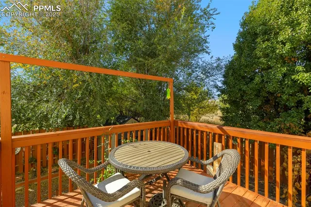 a view of a chair and table in the balcony