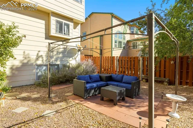 a view of backyard with patio