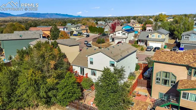 an aerial view of a house with a lake view
