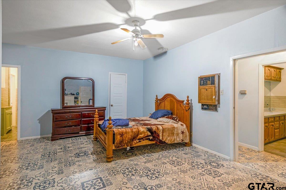3109 West Shaw Street Tyler, TX 75701 - Photo 13 of 27 a bedroom with furniture and a mirror