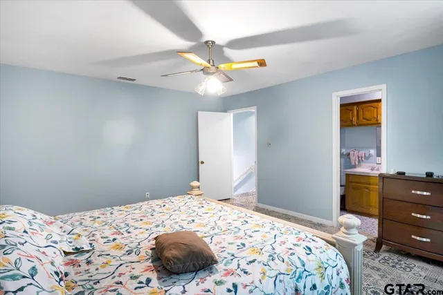 a bedroom with a bed and a dresser