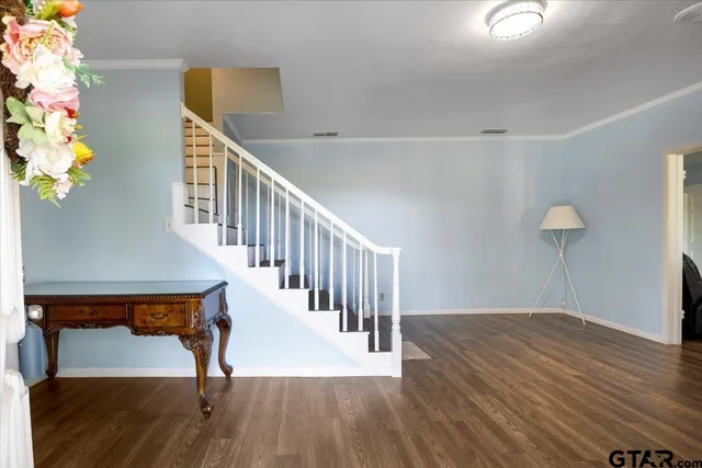a view of entryway with wooden floor