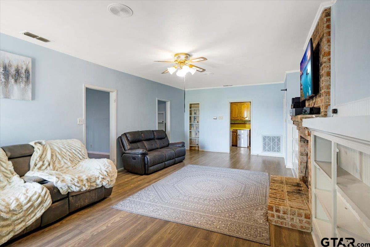 3109 West Shaw Street Tyler, TX 75701 - Photo 9 of 27 a living room with furniture and a chandelier