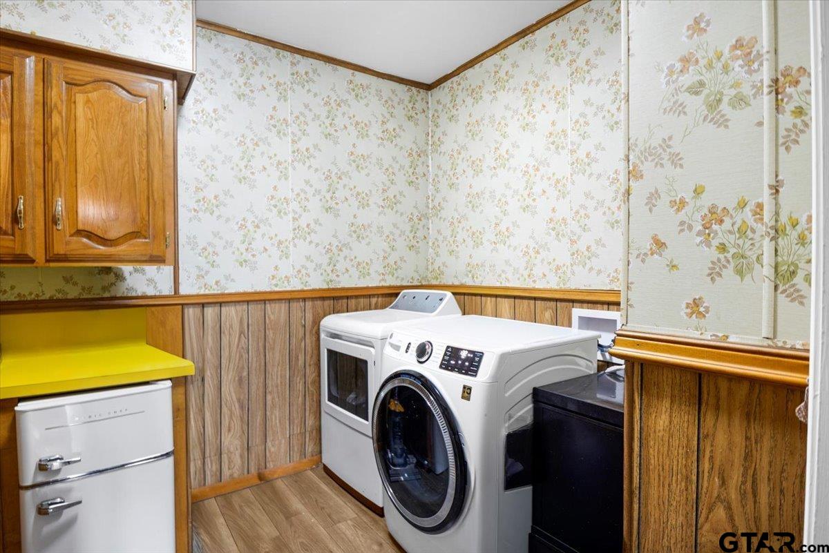 3109 West Shaw Street Tyler, TX 75701 - Photo 10 of 27 a utility room with dryer and washer