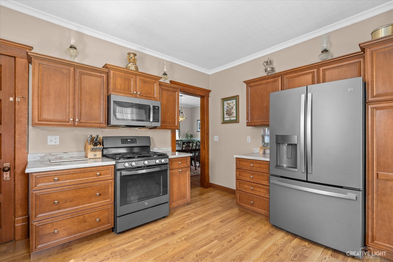 322 East 3rd Street Dixon, IL 61021 - Photo 12 of 30 a kitchen with granite countertop a refrigerator stove and oven