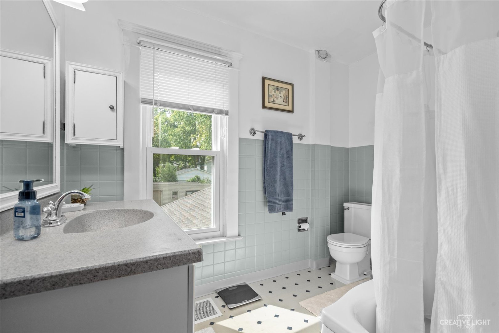 322 East 3rd Street Dixon, IL 61021 - Photo 20 of 30 a bathroom with a sink toilet and shower