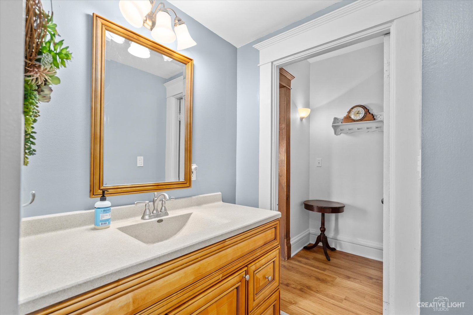 322 East 3rd Street Dixon, IL 61021 - Photo 22 of 30 a bathroom with a sink and a mirror
