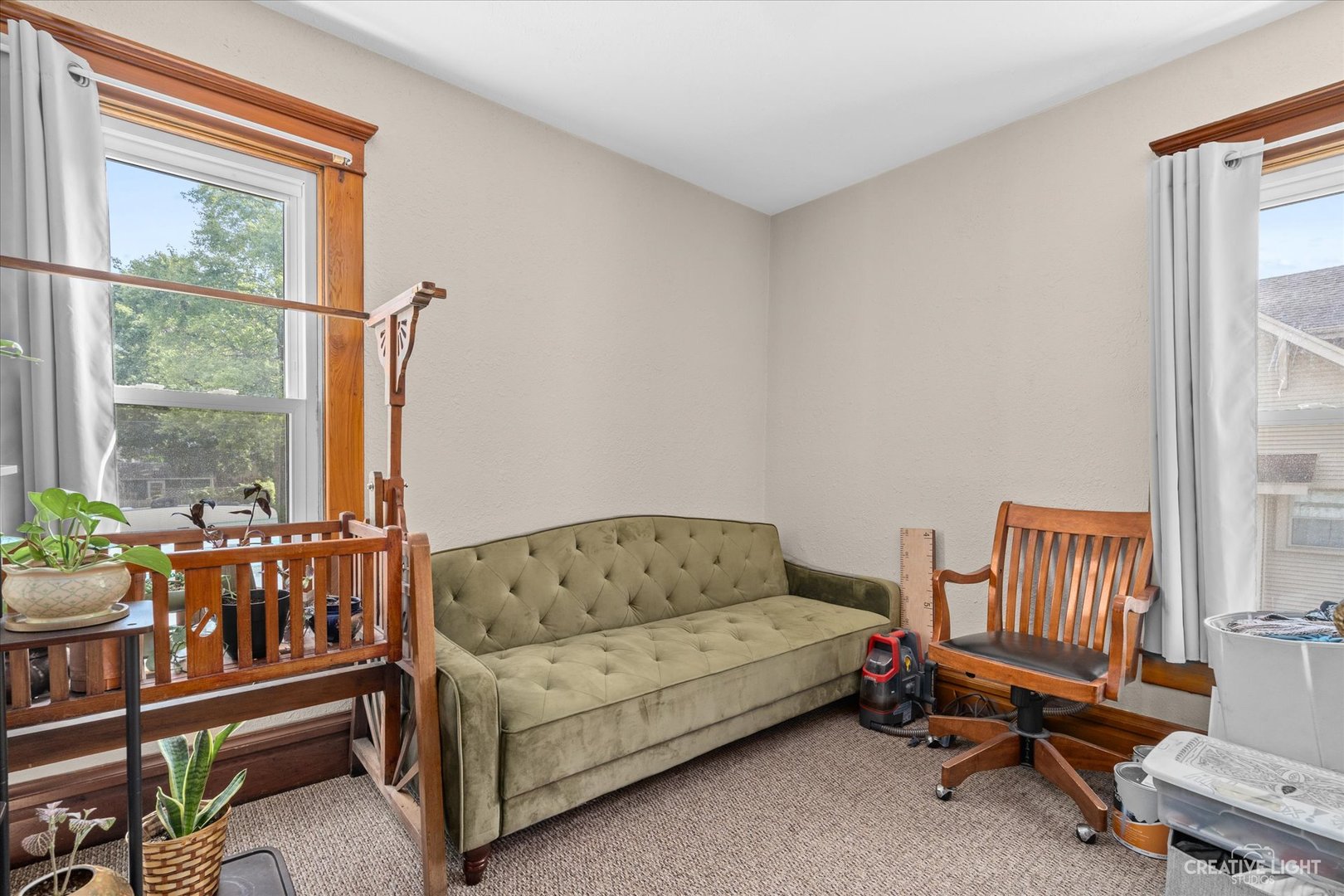 322 East 3rd Street Dixon, IL 61021 - Photo 23 of 30 a living room with furniture and a window