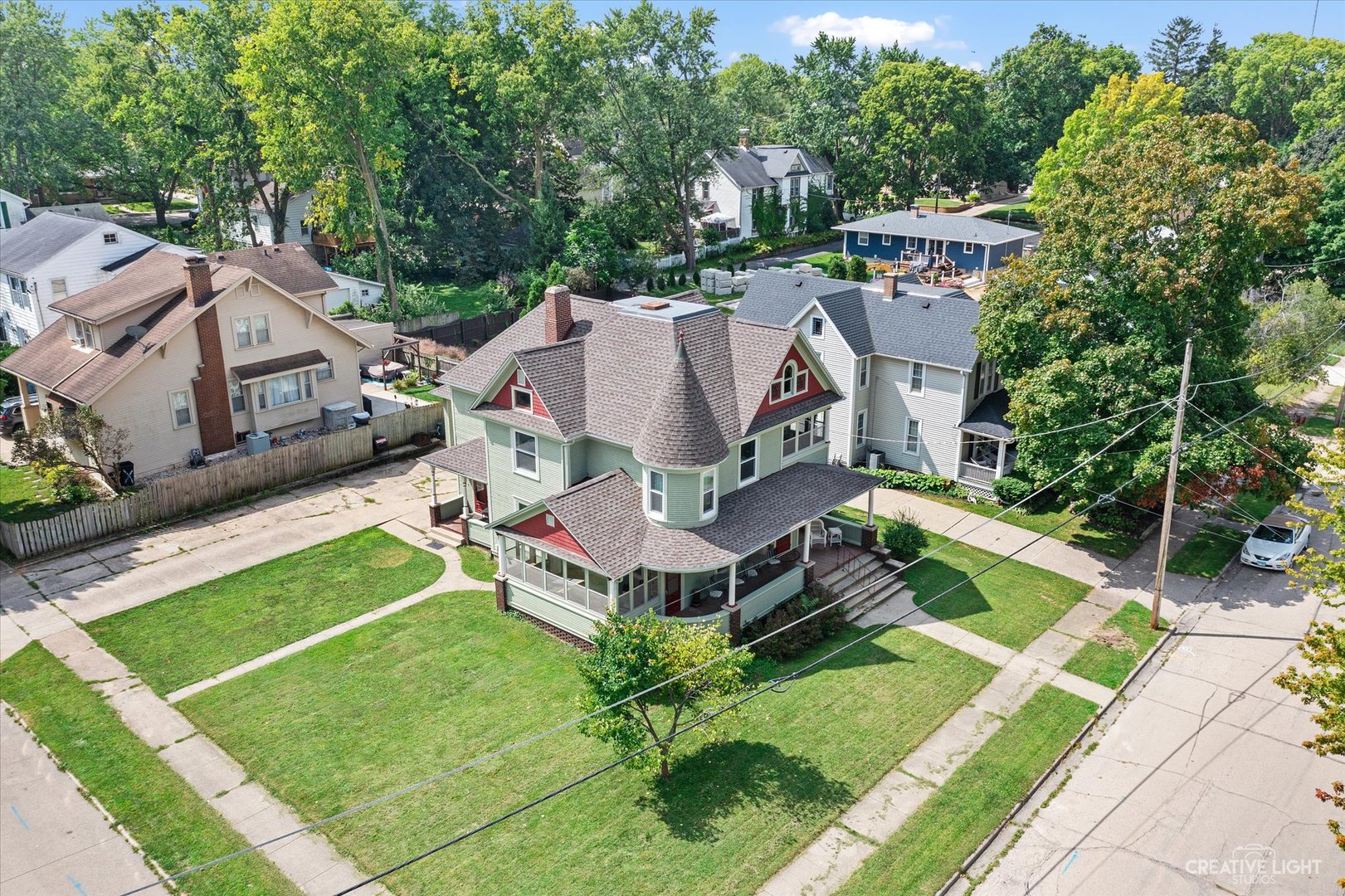 322 East 3rd Street Dixon, IL 61021 - Photo 28 of 30 a aerial view of a house with a big yard potted plants and large tree