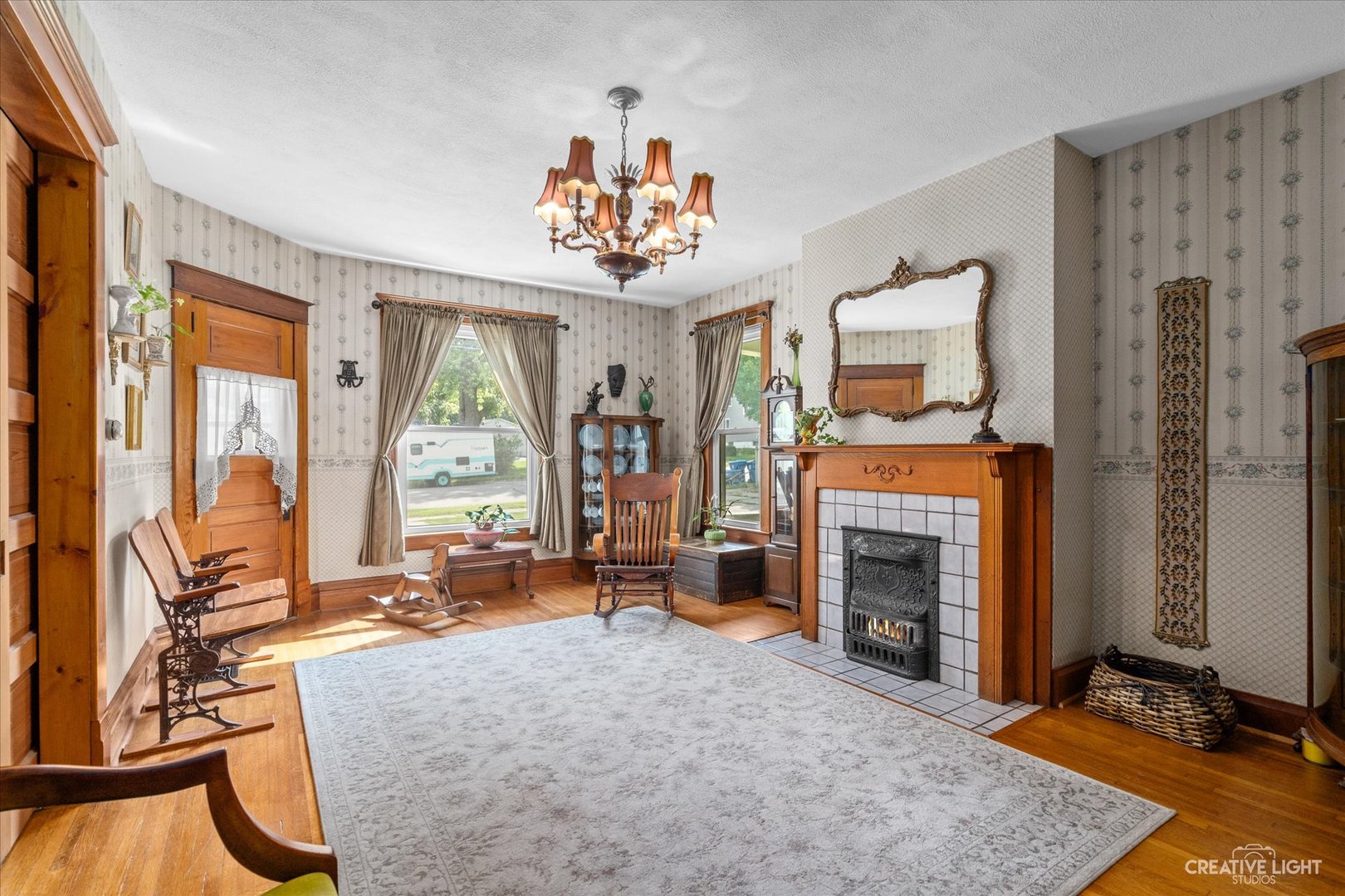 322 East 3rd Street Dixon, IL 61021 - Photo 8 of 30 a view of a livingroom with a fireplace and workspace