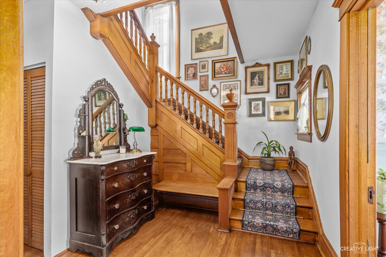322 East 3rd Street Dixon, IL 61021 - Photo 10 of 30 a view of staircase with wooden floor and a rug