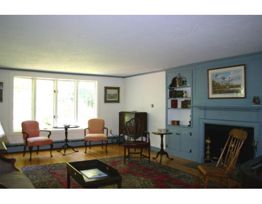 17 Parmenter Road Wayland, MA 01778 - Photo 4 of 18 a living room with furniture and a fireplace