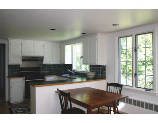17 Parmenter Road Wayland, MA 01778 - Photo 6 of 18 a kitchen with a table chairs a window and appliances