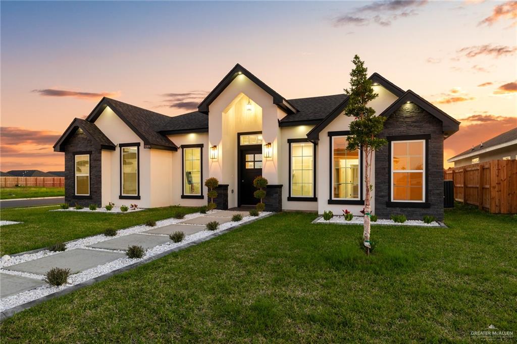 3304 East Rabbit Run Avenue Alton, TX 78573 - Photo 1 of 1 a front view of a house with a yard