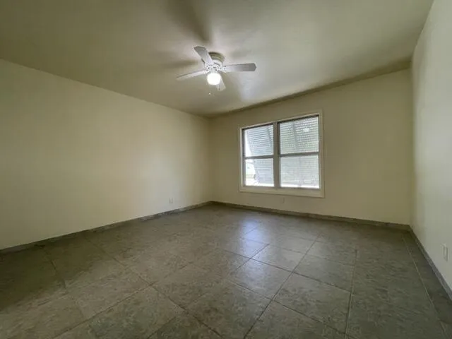 a bathroom with a toilet sink and shower