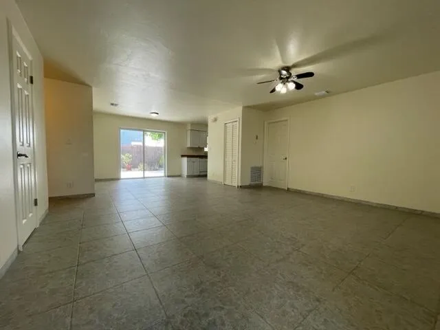 an empty room with a empty space and windows