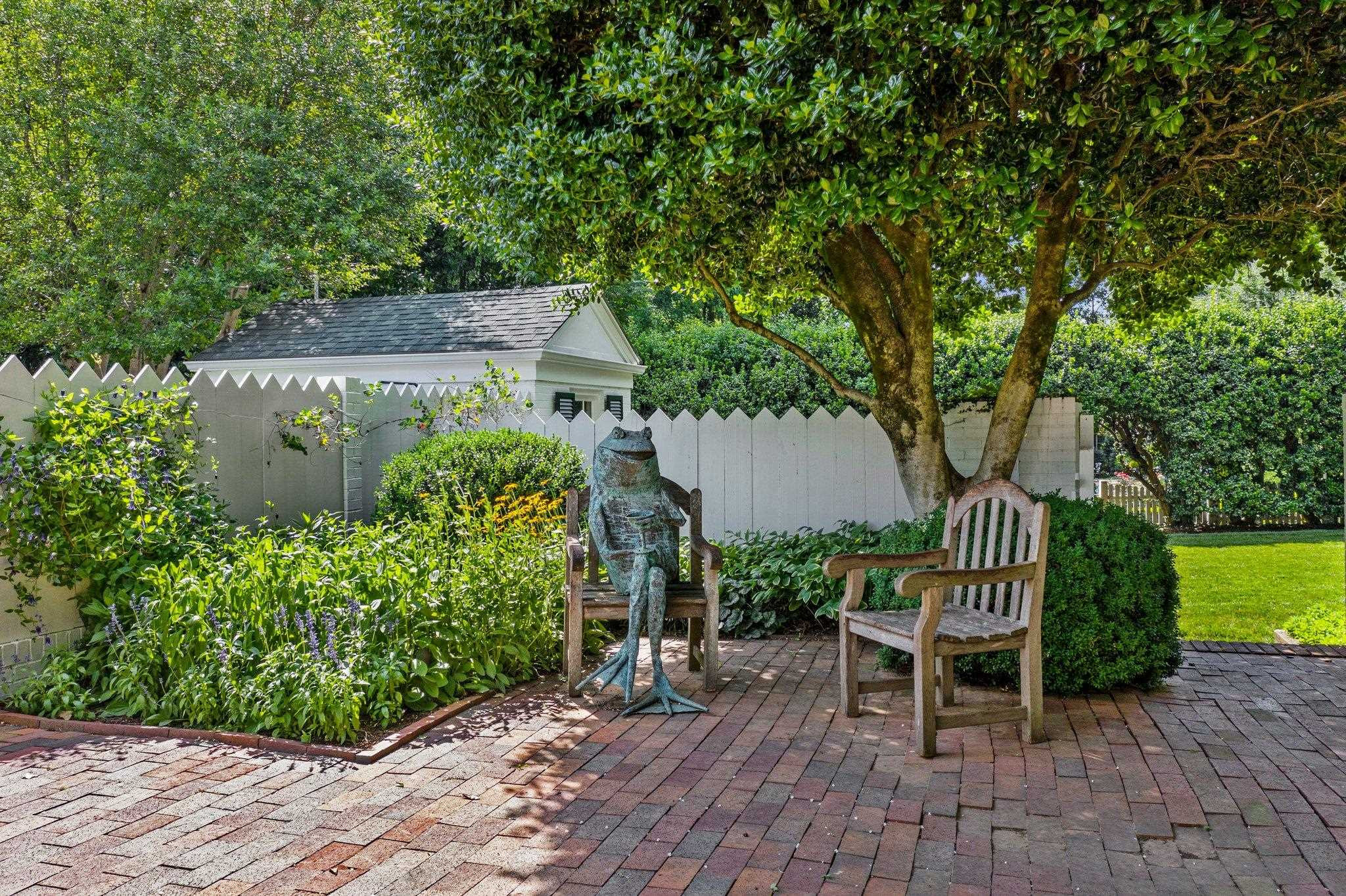 2217 St Marys Street Raleigh, NC 27608 - Photo 42 of 52 Unique patio with brick walls, multiple sitting areas and gardens-a peaceful oasis from the rest of Raleigh. The yard adds tranquility, reflection and ambiance to the landscape. Patio