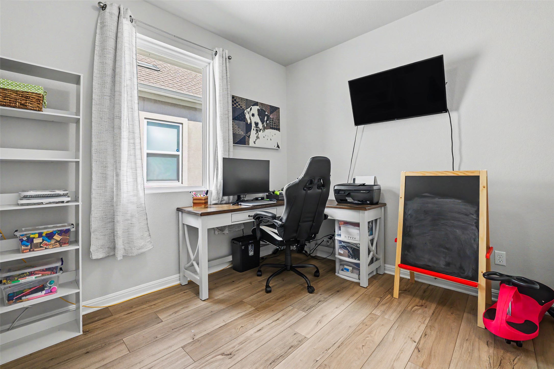 112 Rocking R Court Georgetown, TX 78633 - Photo 31 of 40 Hardwood-style flooring and a functional work area define this flexible-use room.