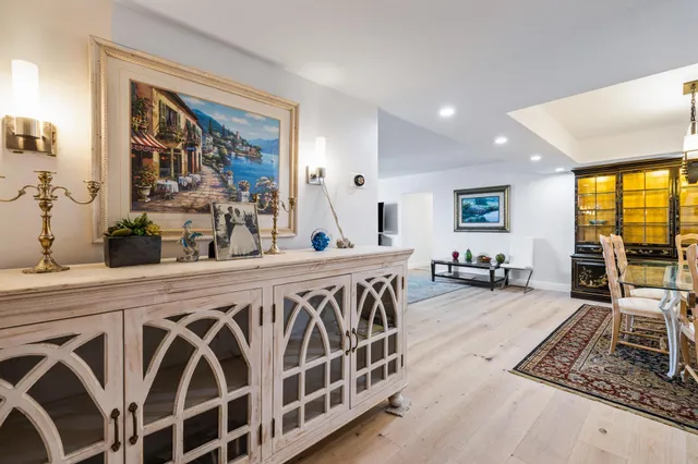 a kitchen with stainless steel appliances granite countertop a stove a sink and a granite counter tops