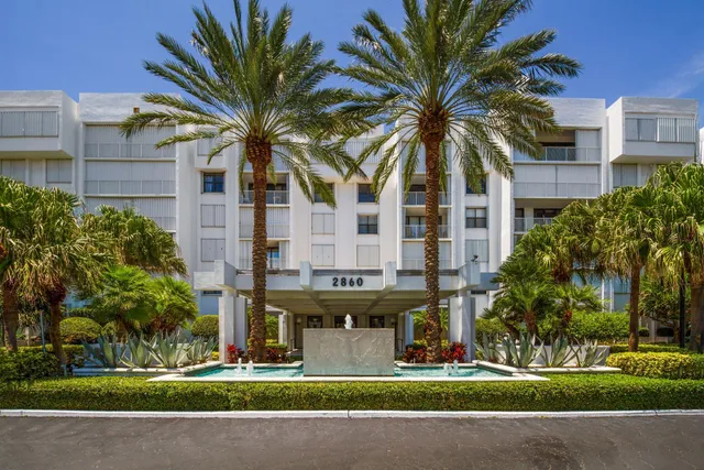 front view of a building with a garden