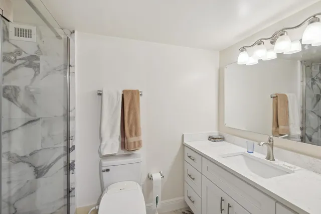 a bathroom with a double vanity sink mirror and