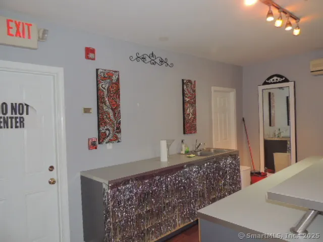 a bathroom with a sink a mirror and a toilet