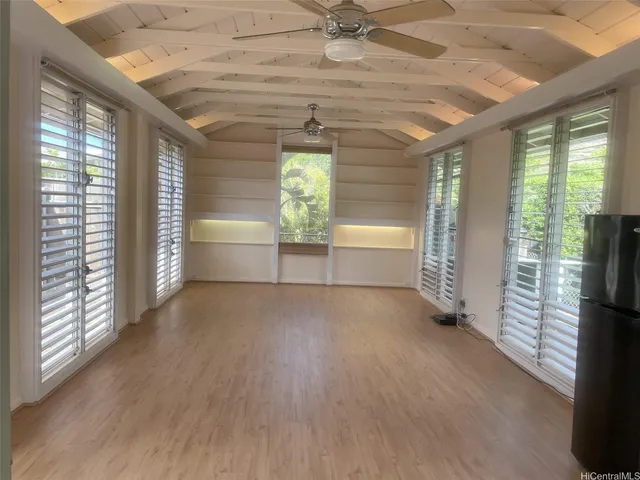 a view of an empty room and a window