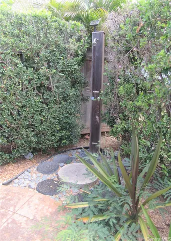 a view of a tall building with trees in front of it