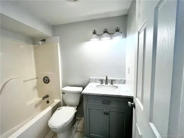 a view of a room with floor to ceiling window and mountain view