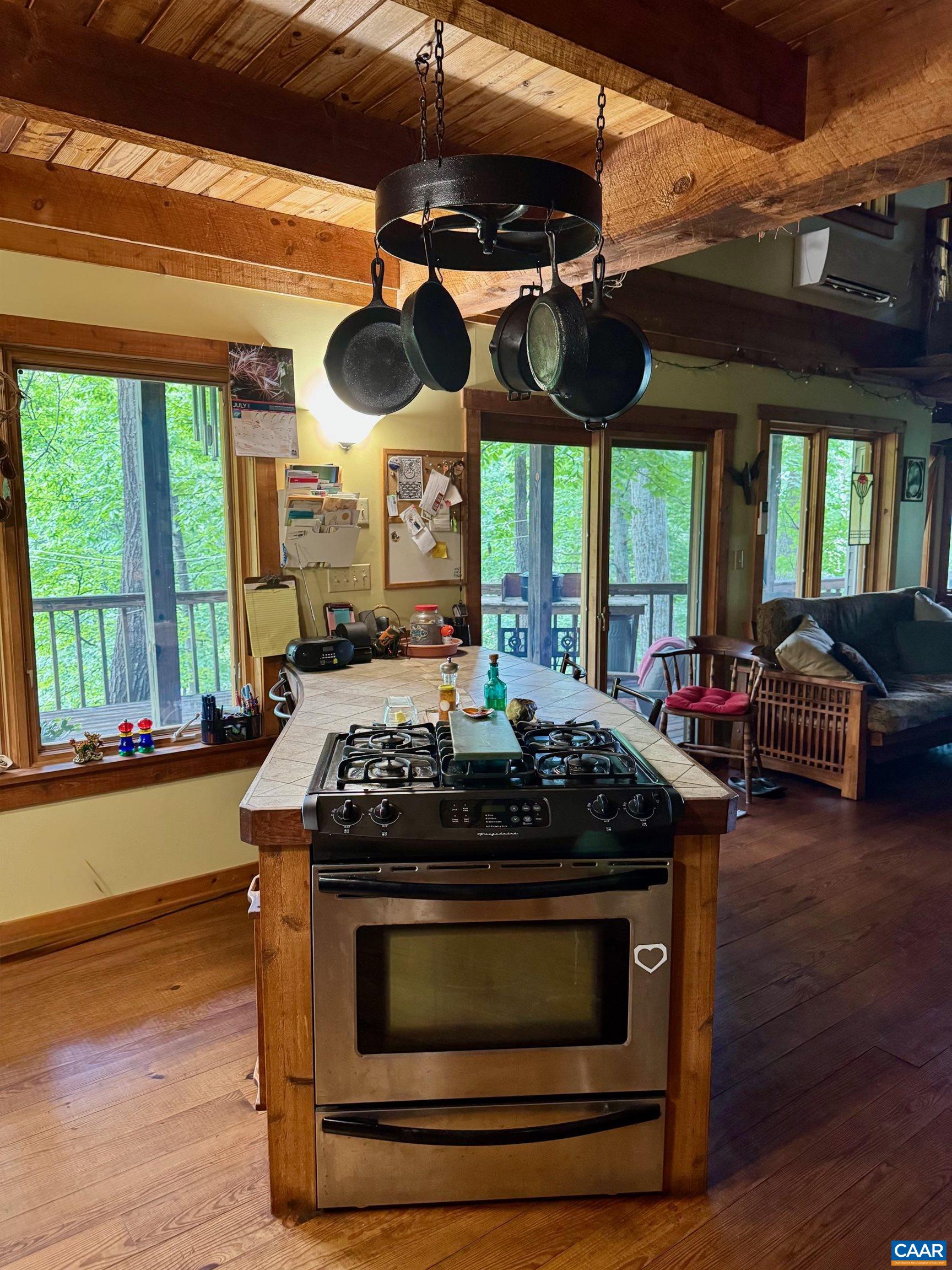 1950 Locust Hollow Road Charlottesville, VA 22903 - Photo 21 of 54 a kitchen with a stove and a wooden floor