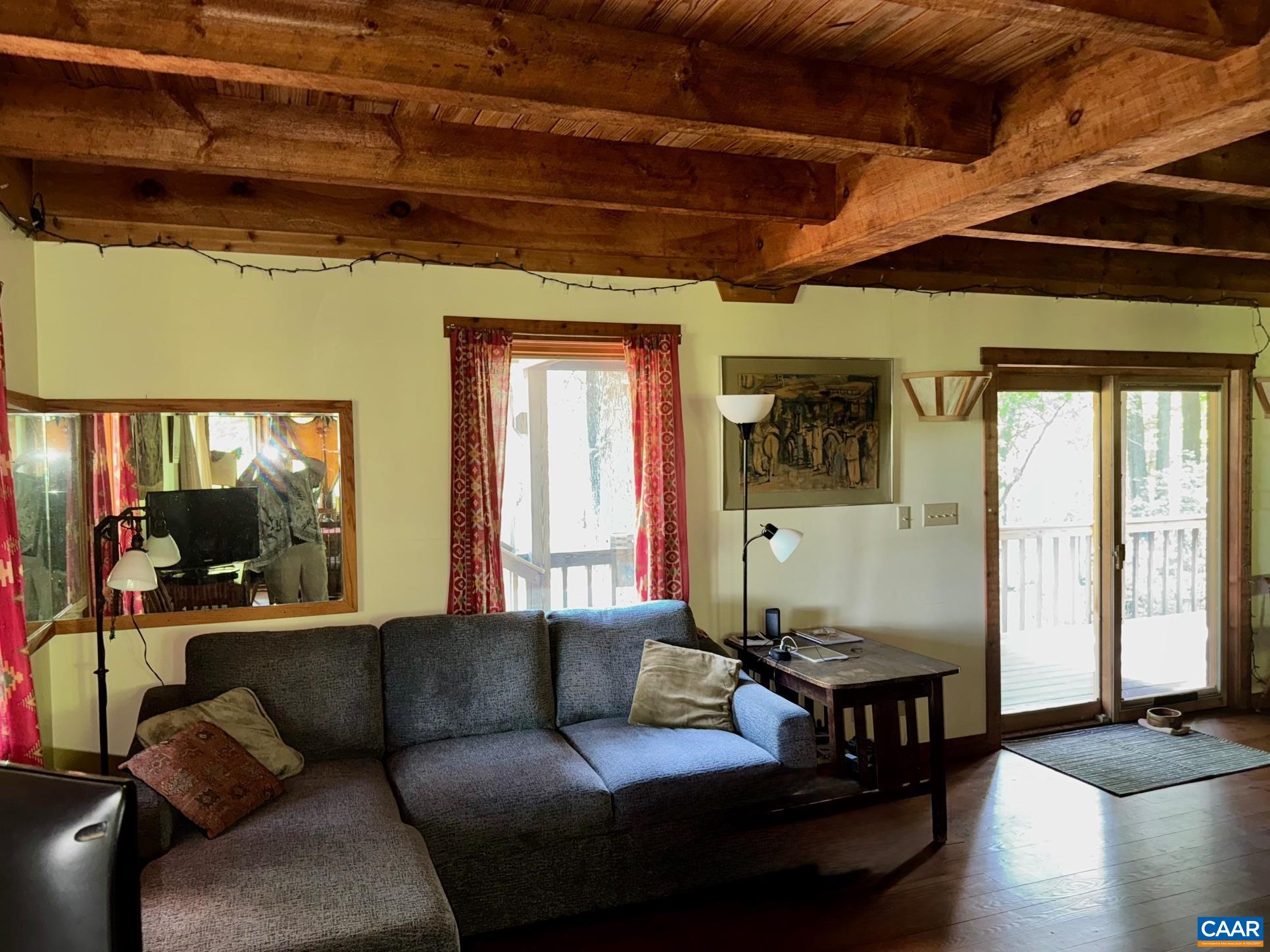 1950 Locust Hollow Road Charlottesville, VA 22903 - Photo 25 of 54 a living room with furniture and a large window