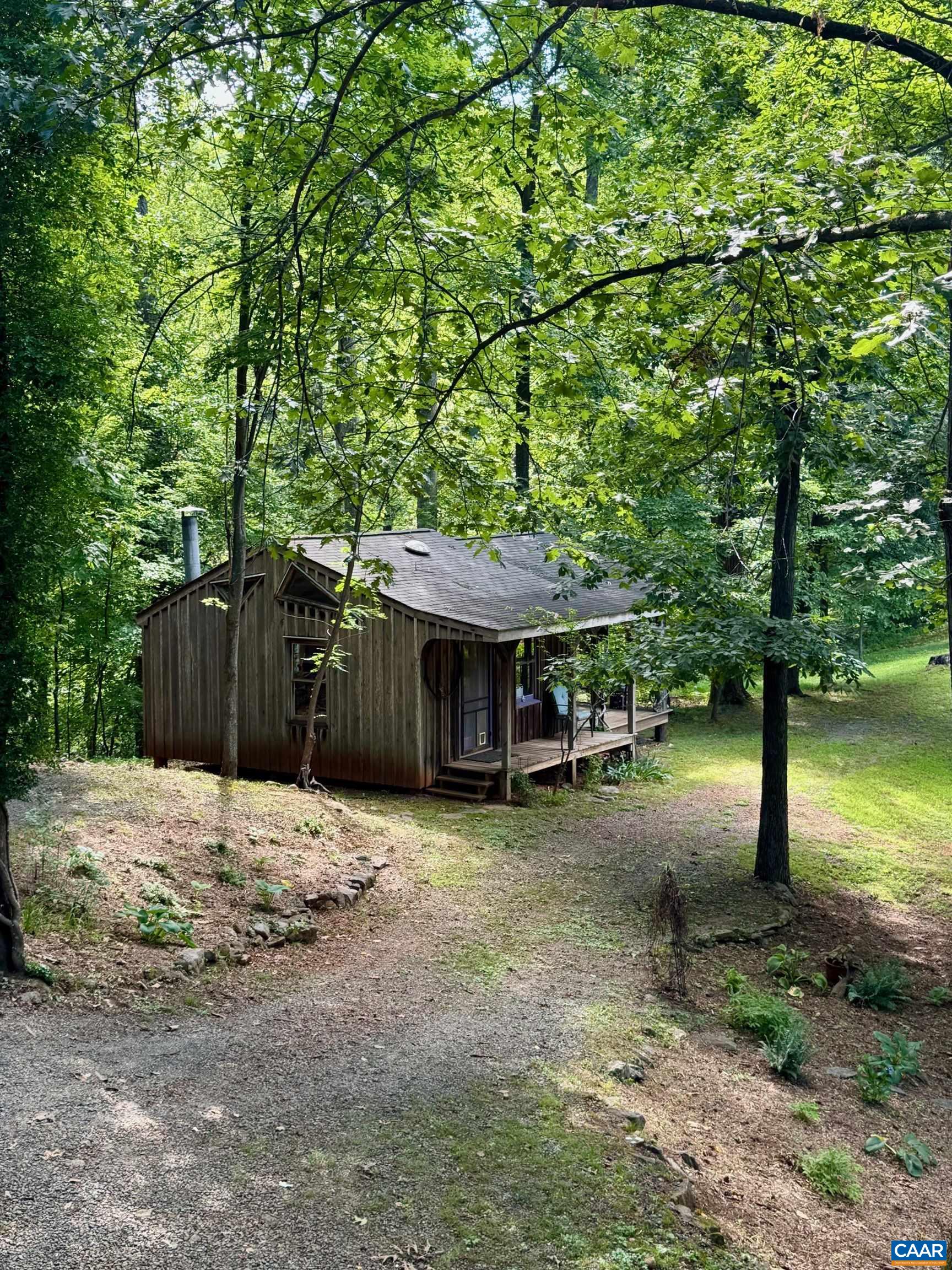 1950 Locust Hollow Road Charlottesville, VA 22903 - Photo 31 of 54 a wooden house with trees in front of it