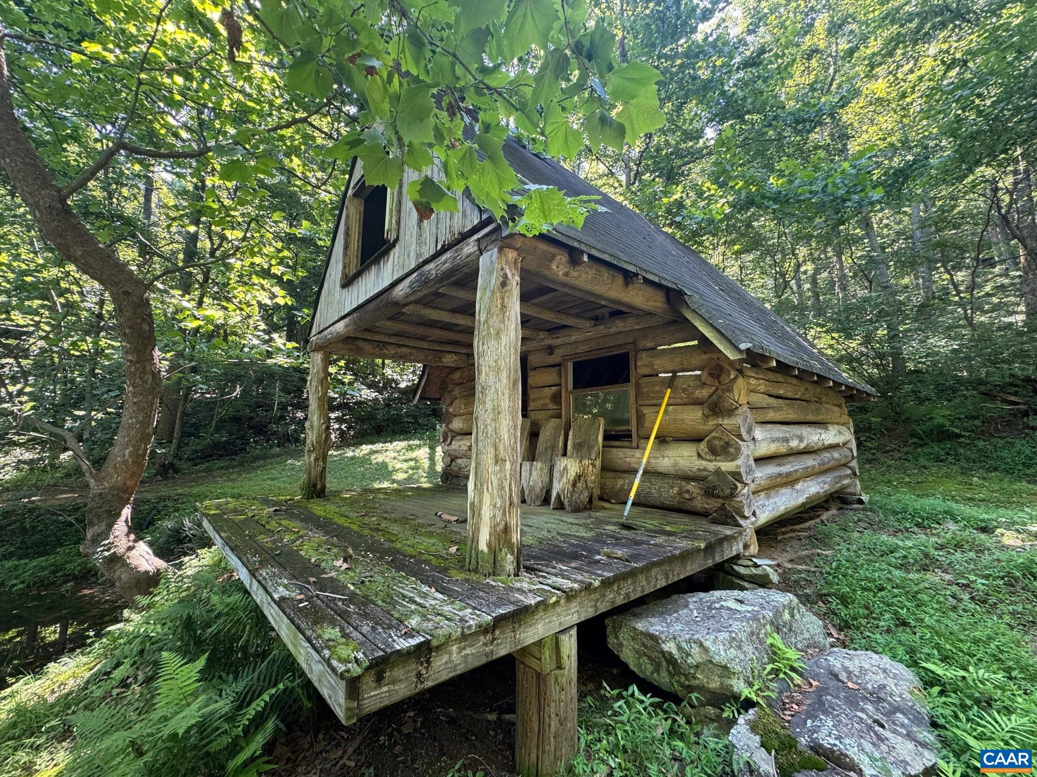 1950 Locust Hollow Road Charlottesville, VA 22903 - Photo 43 of 54 a view of a small house in the forest