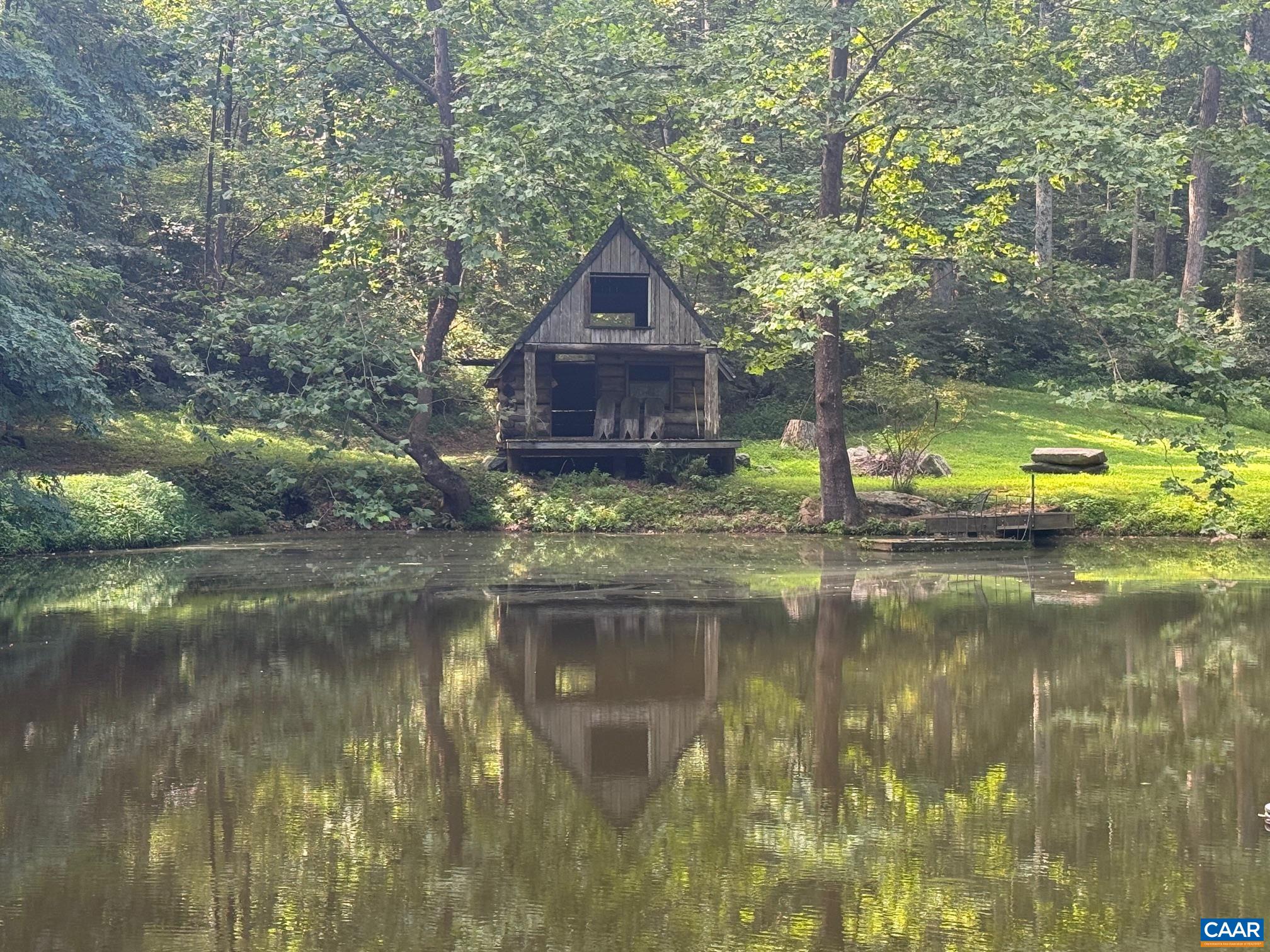 1950 Locust Hollow Road Charlottesville, VA 22903 - Photo 45 of 54 a view of a house with a yard