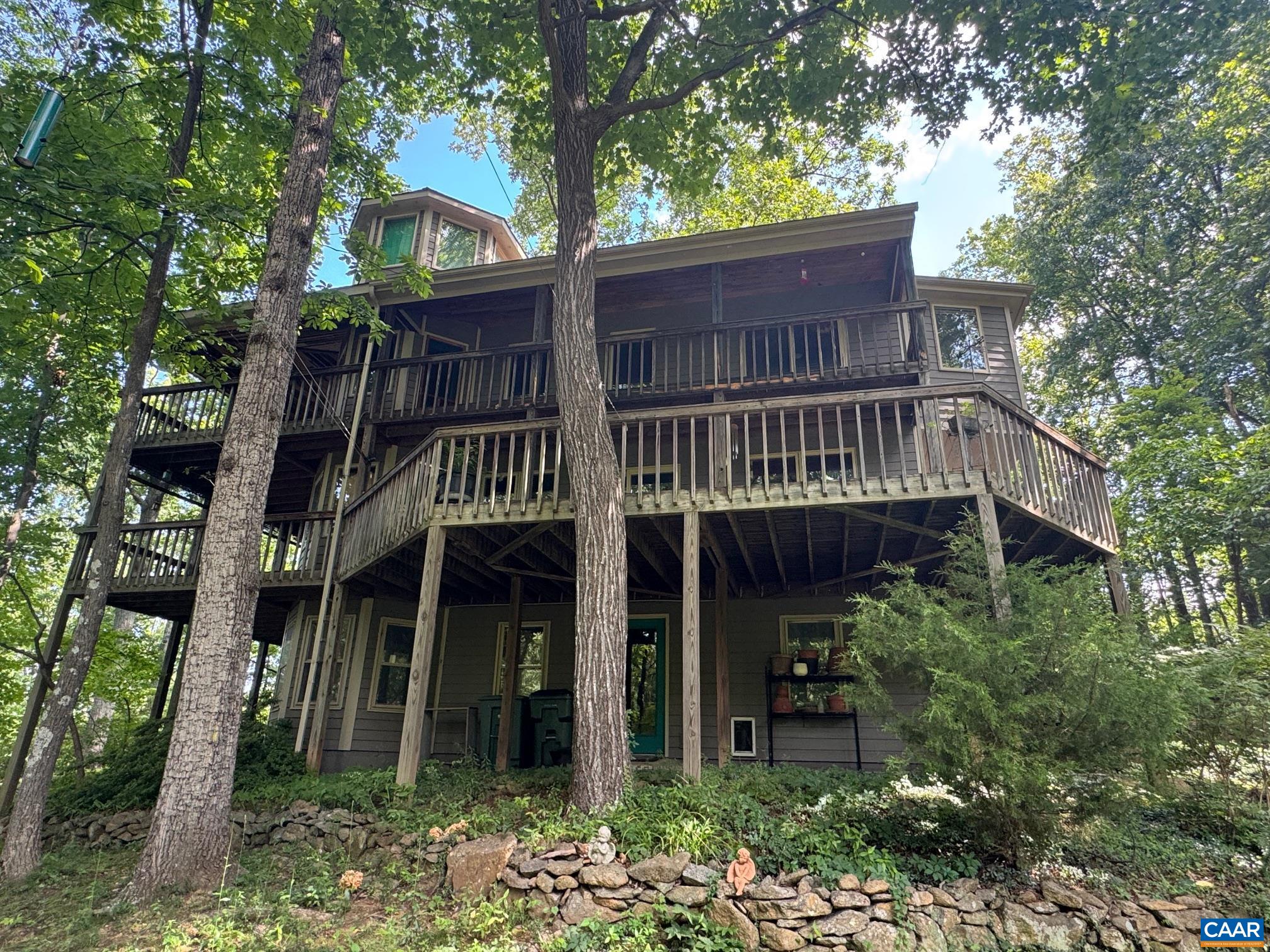 1950 Locust Hollow Road Charlottesville, VA 22903 - Photo 6 of 54 a view of an house with backyard and trees