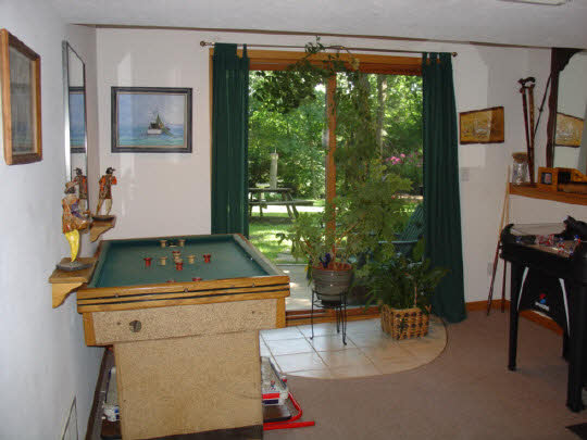 233 Rochester Road Northeast Poplar Grove, IL 61065 - Photo 8 of 11 a living room with a table chairs and a large window