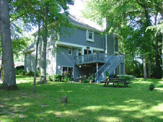 233 Rochester Road Northeast Poplar Grove, IL 61065 - Photo 9 of 11 a front view of house with a garden and trees