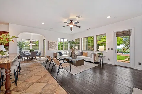 a living room with furniture fireplace and a flat screen tv