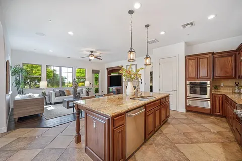 a kitchen with a stove and a refrigerator