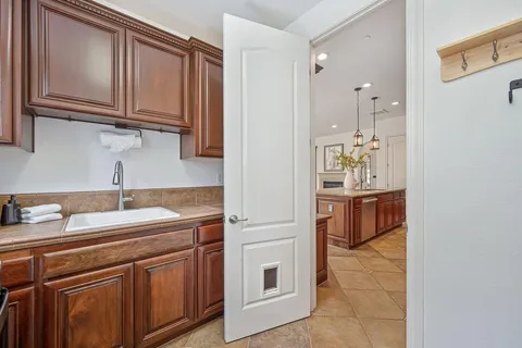 a bedroom with a bed and a potted plant