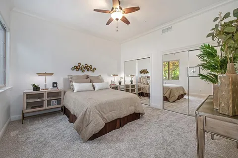 a view of a dining room with a table and chairs