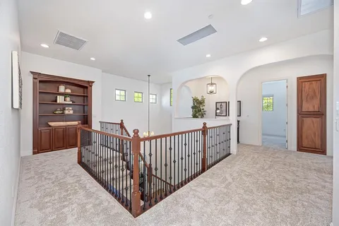 a spacious bedroom with a bed and a window