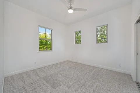 a spacious bathroom with a sink double vanity and a mirror