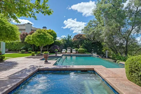 a view of a lake with chairs