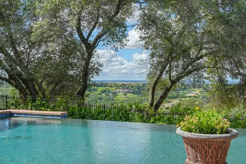 a view of a balcony with trees